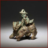 figure riding lion